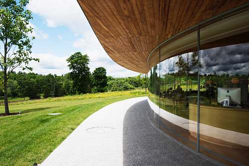 new canaan brown wooden pathway near green grass field during daytime grace farms